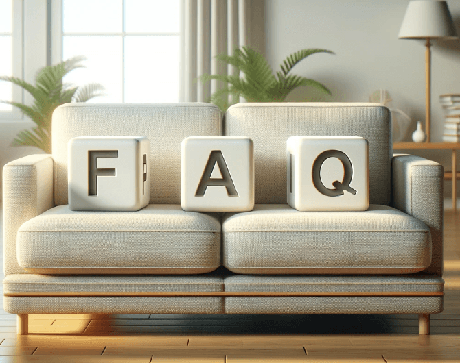 A cozy living room with a beige sofa. Three large blocks with the letters F, A, and Q are placed on the cushions, spelling FAQ. Sunlight streams in, and green plants decorate the background.