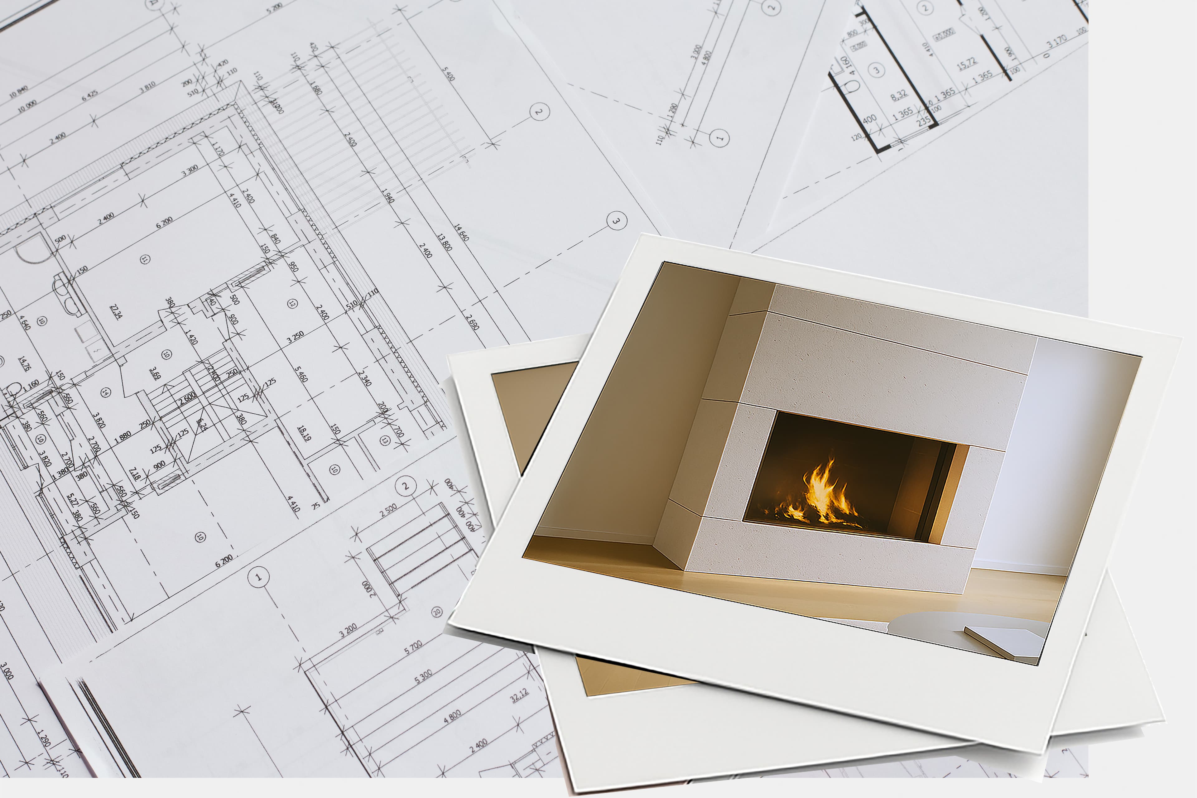 Twee afgedrukte foto's van een moderne open haard zijn bovenop bouwkundige blauwdrukken geplaatst, waardoor interieurinspiratie wordt vermengd met bouwtekeningen.